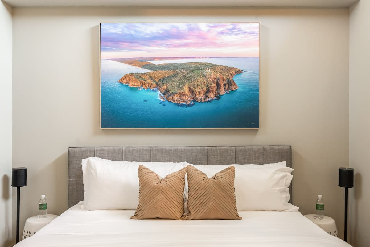 Boasting tall ceilings, the bedroom combines comfort and style for a truly luxurious retreat.