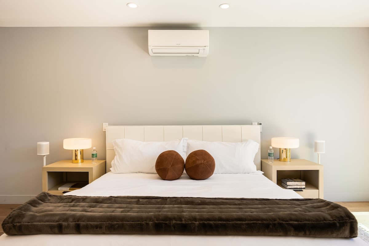 Featuring a lush bed adorned with crisp, fresh linens.
