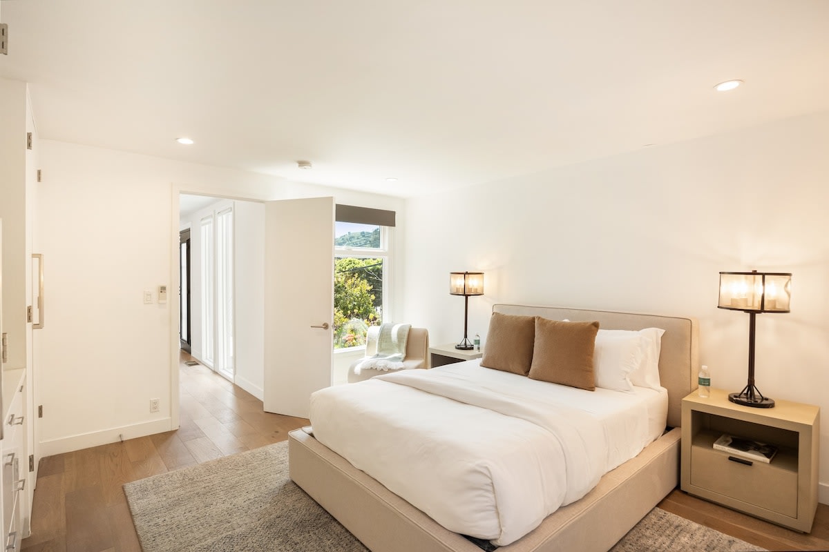 Featuring a lush bed adorned with crisp, fresh linens.