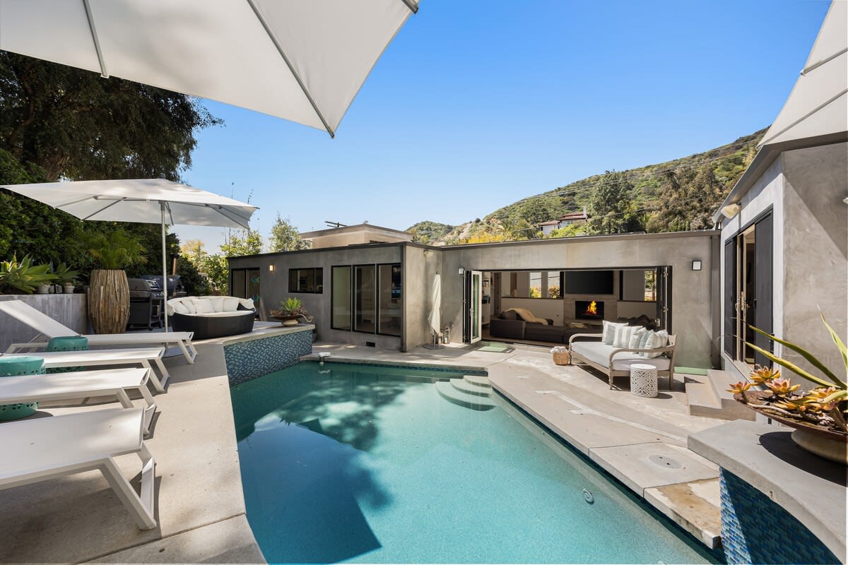 Unwind in shaded bliss under elegant umbrellas.