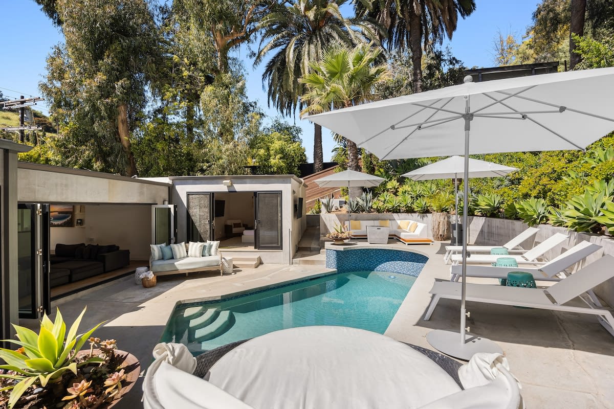 Lounge in luxury on sunbeds, soaking up the sun's warmth by the poolside.