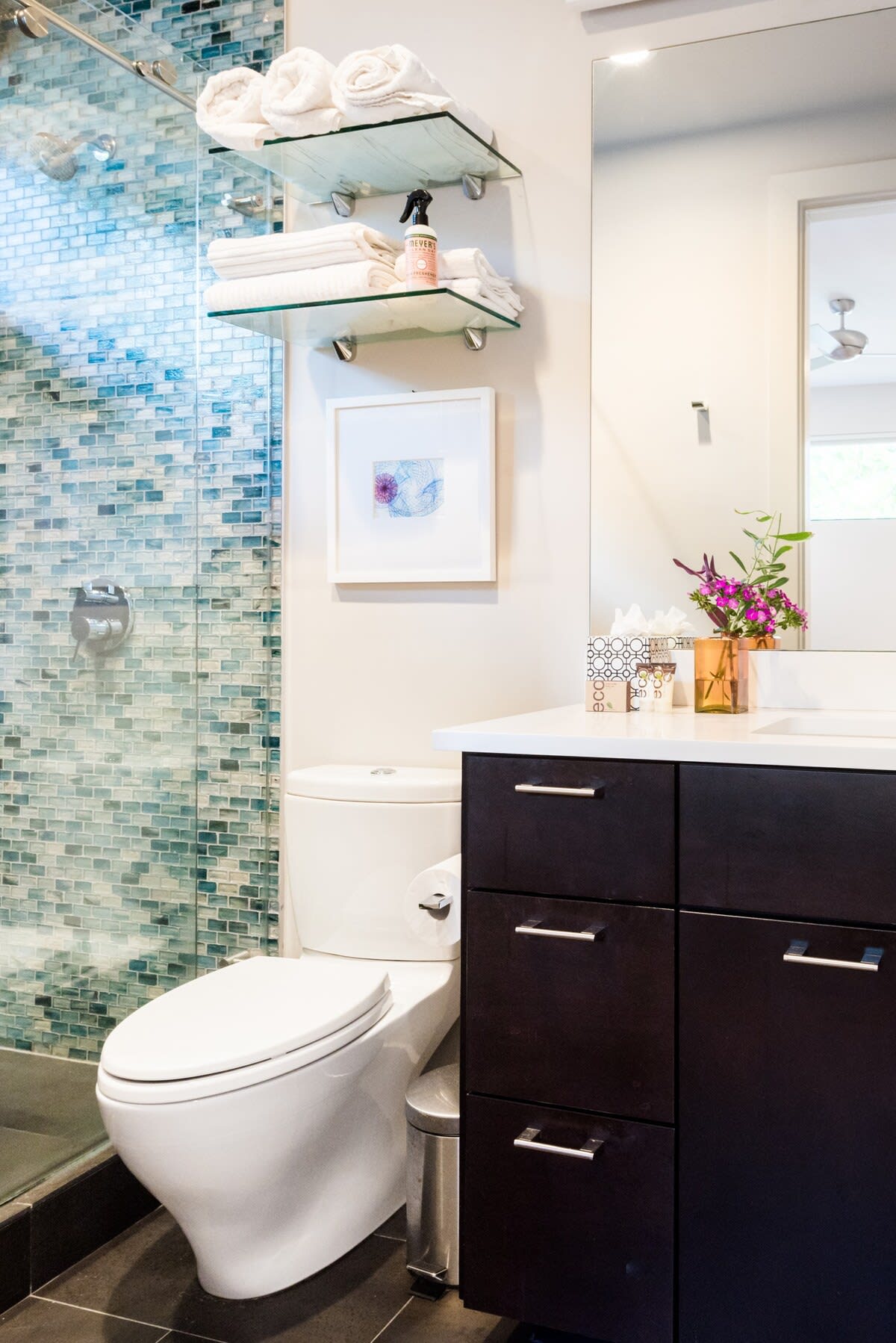 Custom cabinetry, tilework. and glazing complete the bathroom with 100% cotton towels.