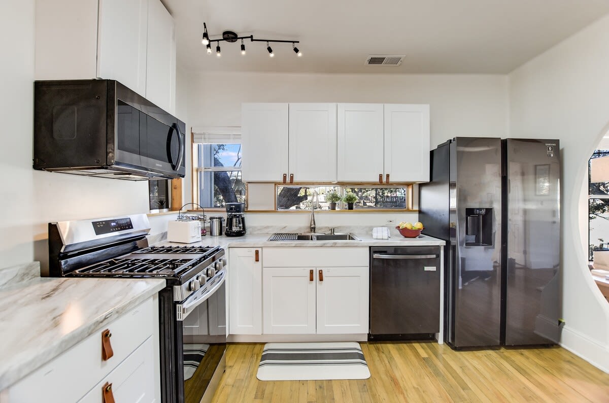 The kitchen is newly remodeled featuring stainless appliances, marble countertops, gadgets and serving sets you need to prepare and serve a home-cooked meal.