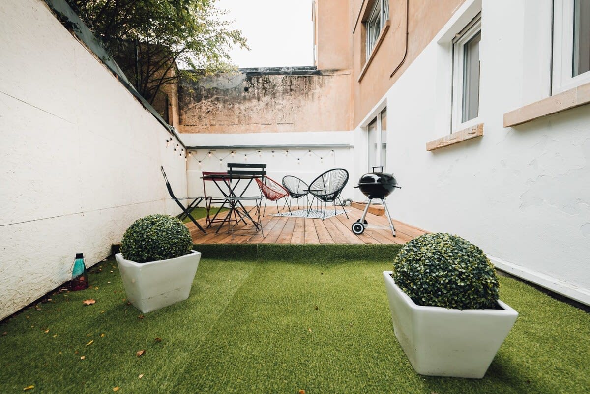 Private outdoor patio with seating area, ideal for enjoying morning coffee or evening drinks in a peaceful setting.