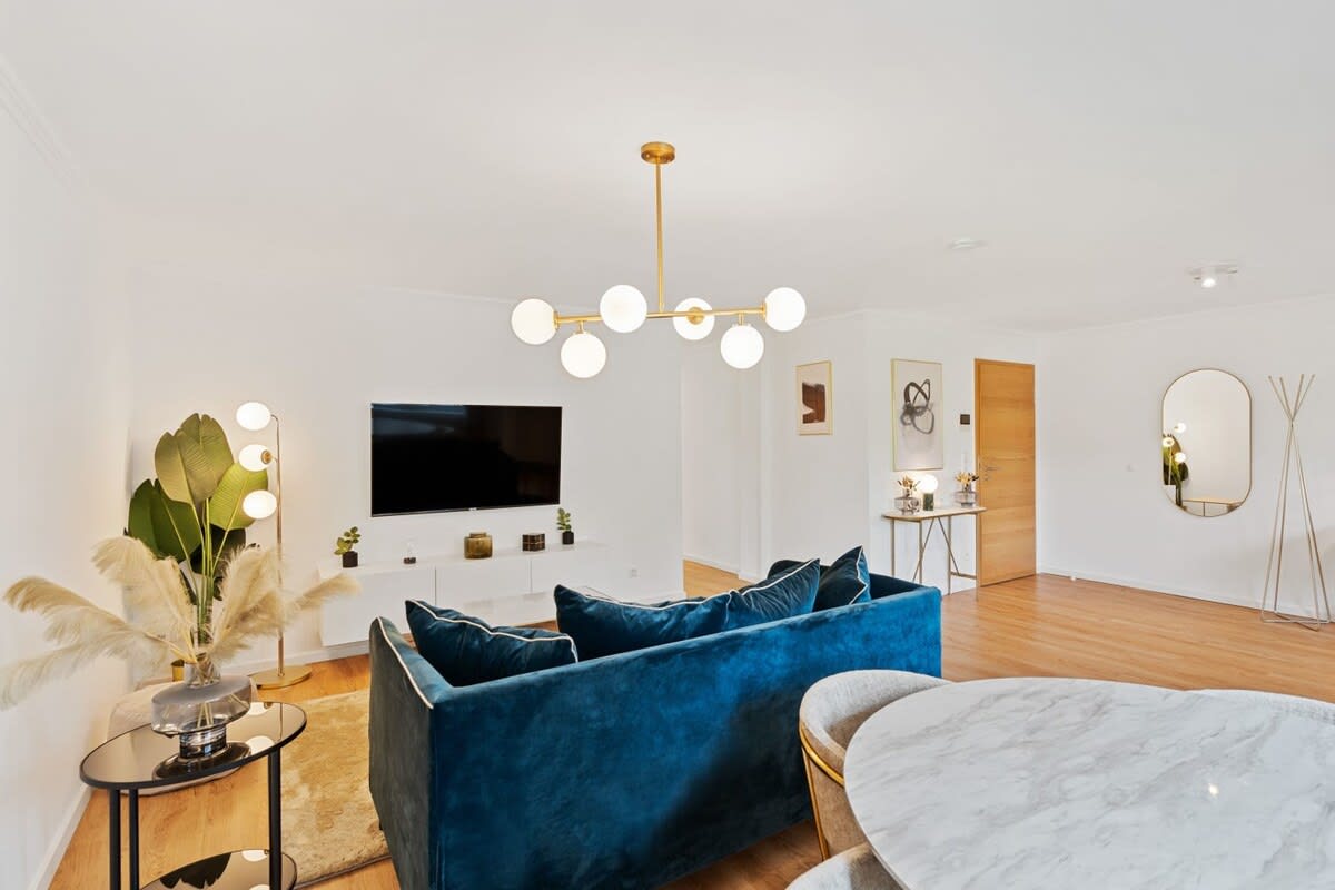 Cozy living room with modern amenities and ample seating for comfort.
