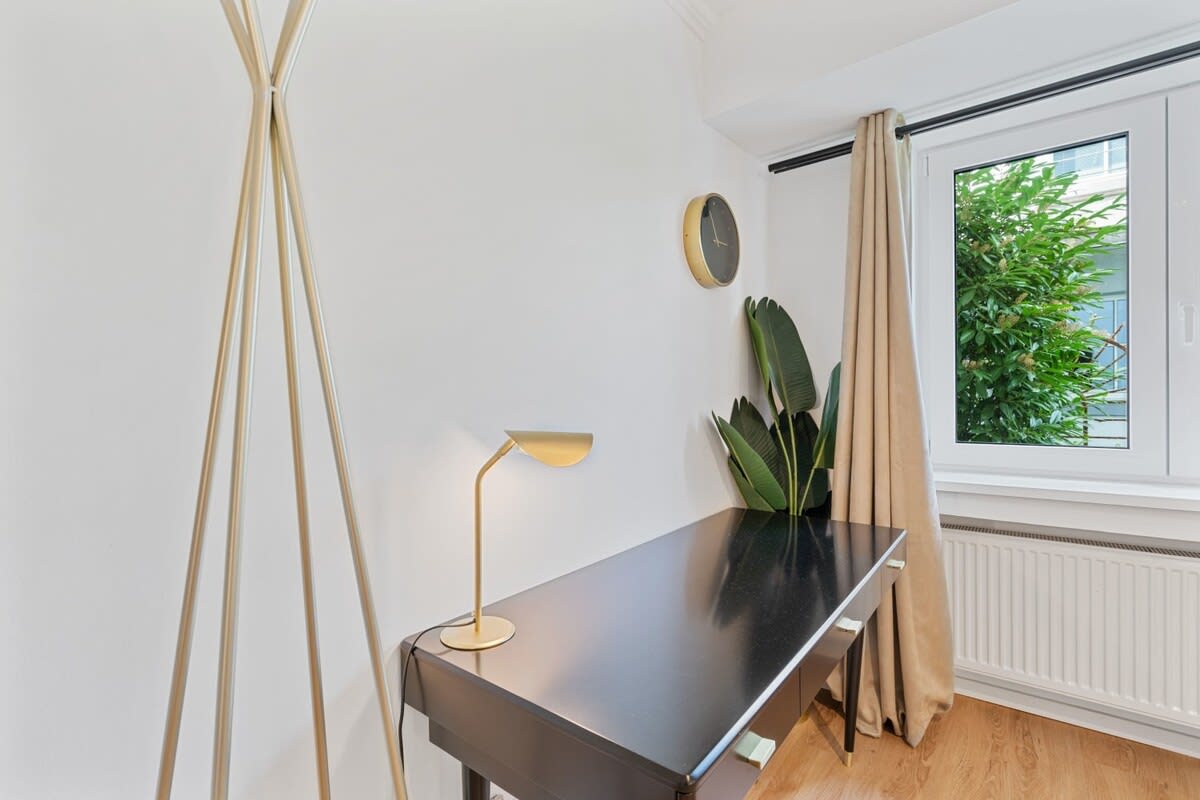 Bright and stylish workspace with natural light and modern touches.