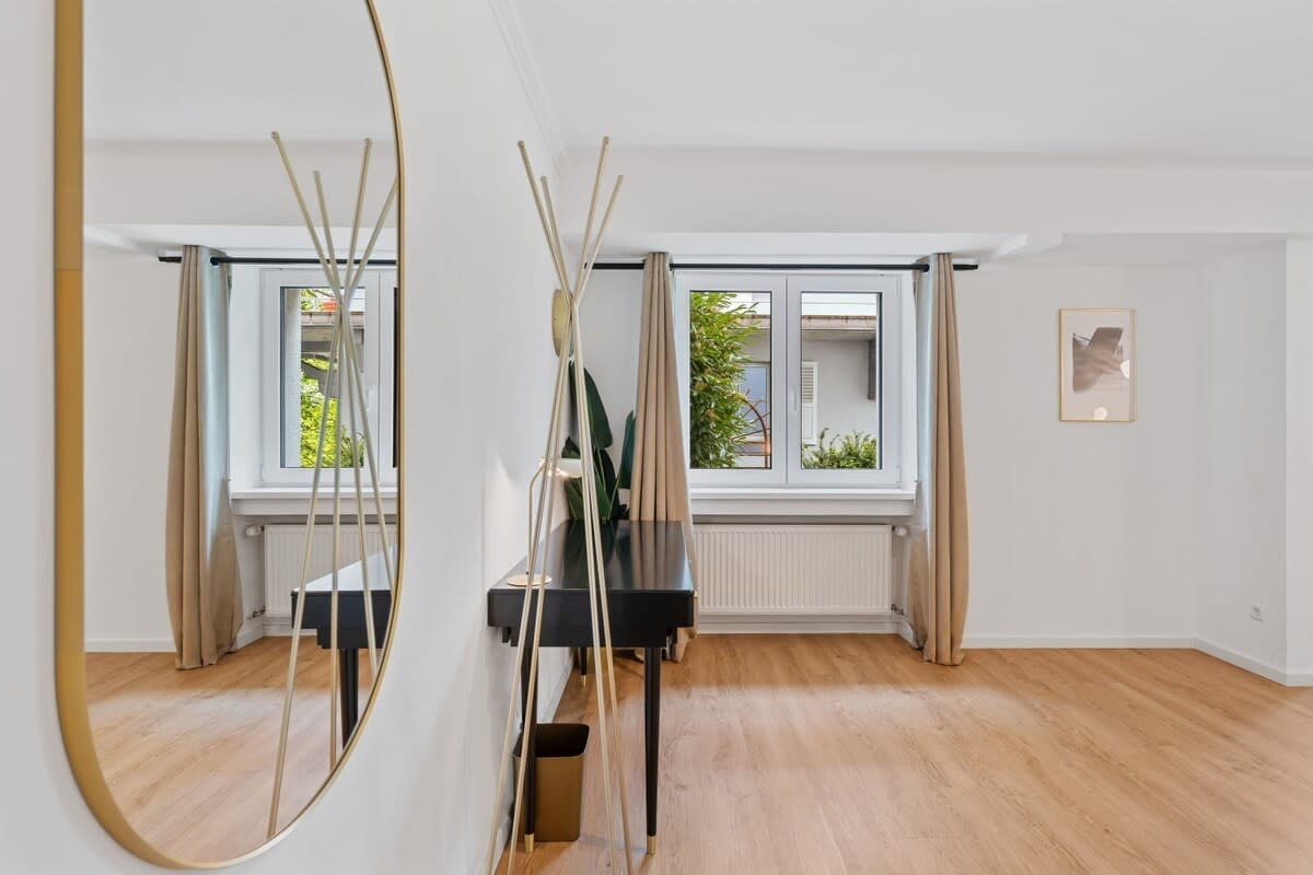 Bright and airy room with modern decor, offering a serene and comfortable space.