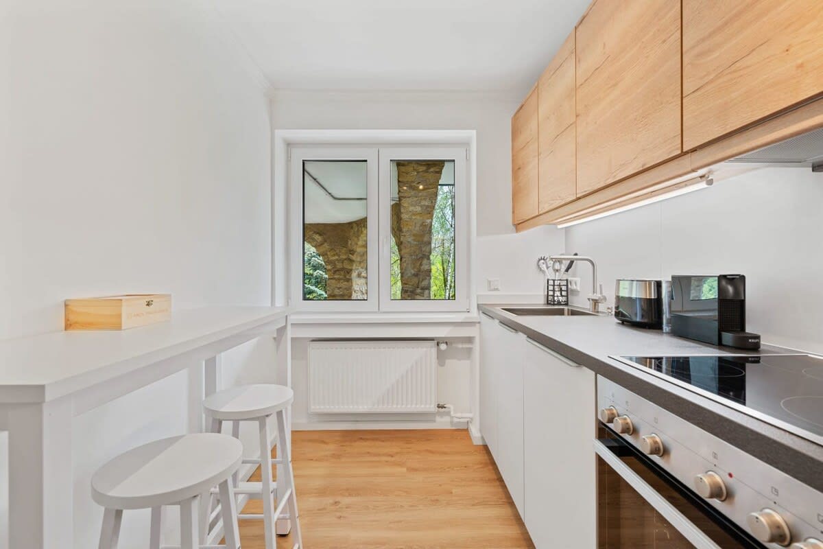 Modern kitchen and dining area, perfect for enjoying meals with a view.