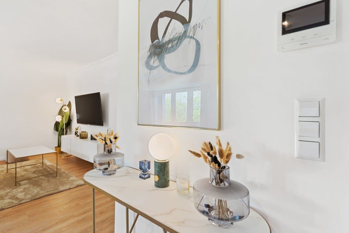 Elegant console table with chic decor adds a stylish touch to your stay.