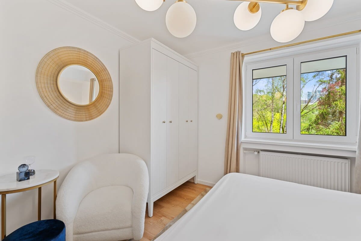 Comfortable bedroom with elegant decor, perfect for a restful night's sleep.