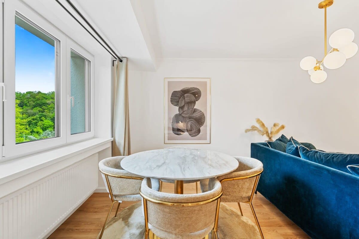 Bright dining area with a scenic view, ideal for enjoying your meals.