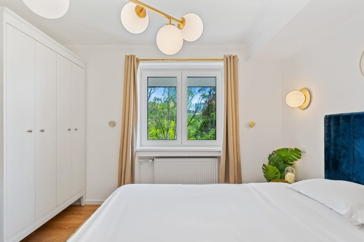Bright and cozy bedroom with ample storage and a beautiful view.