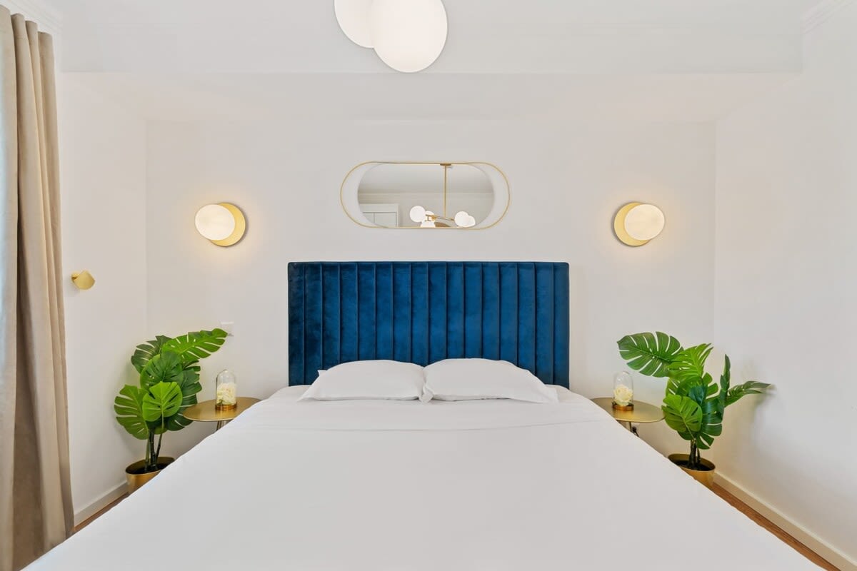 Elegant bedroom featuring a plush headboard and relaxing ambiance.