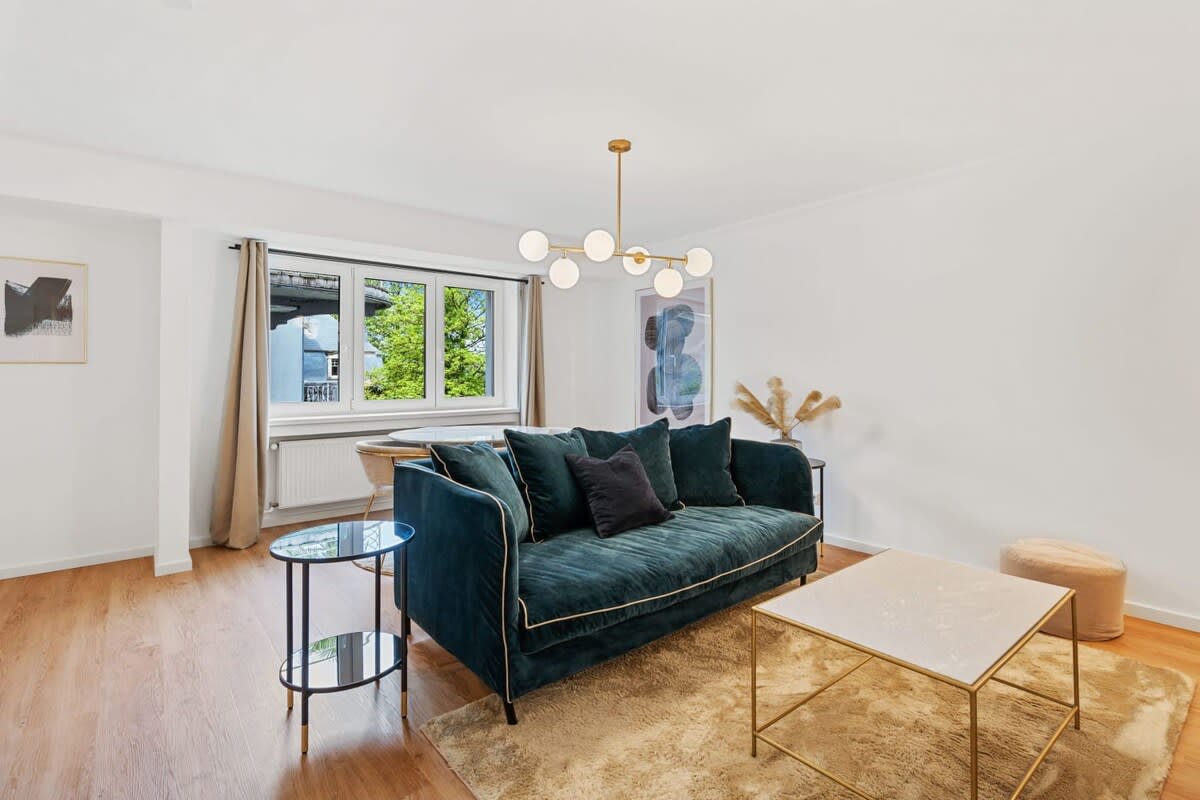 Bright and inviting living room with elegant furnishings for relaxation.