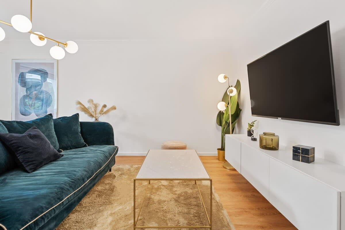 Comfortable living room with stylish decor and modern entertainment system.