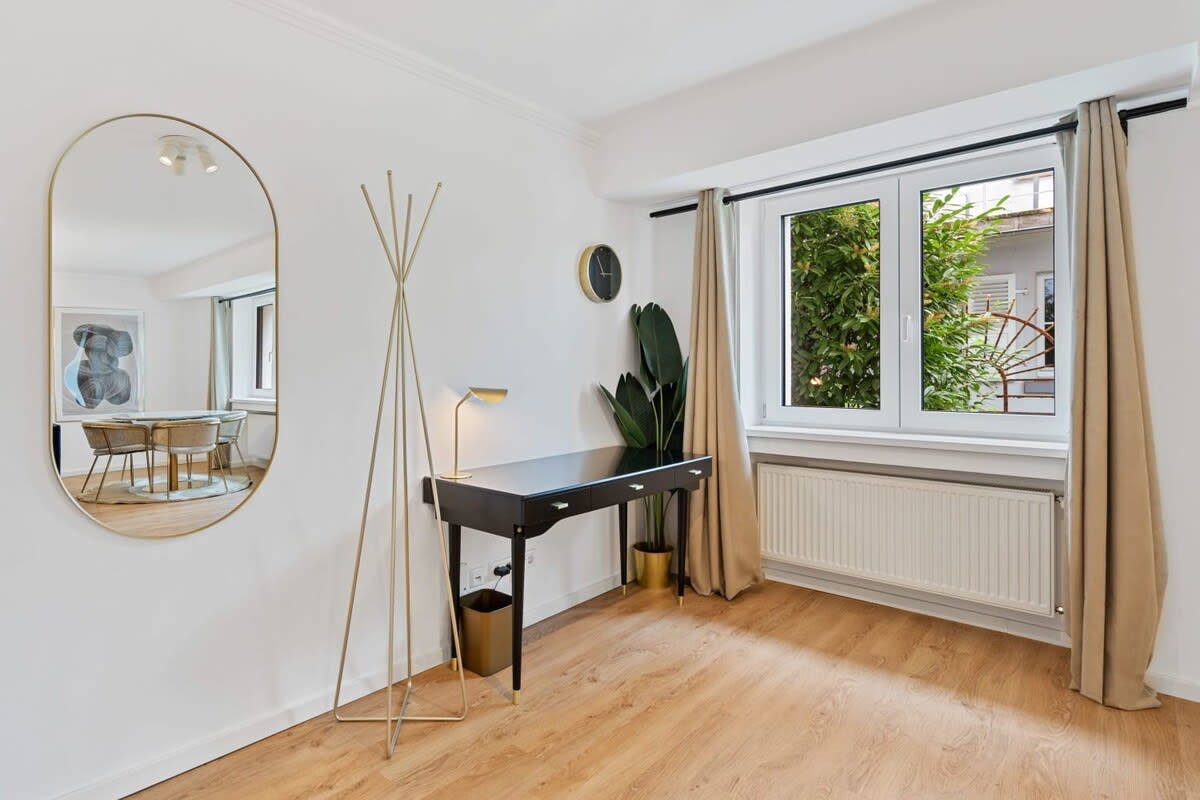 Stylish workspace with plenty of natural light, perfect for productivity.