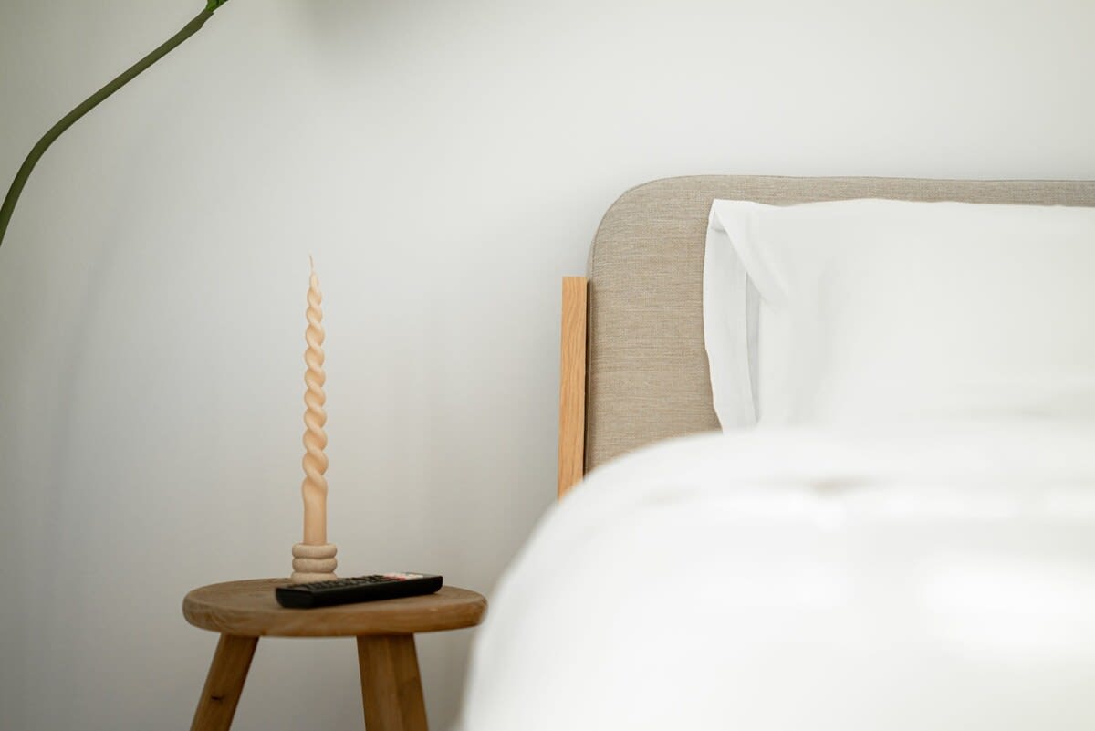 Restful bedroom corner with artistic touches and serene ambiance for a peaceful night's sleep.