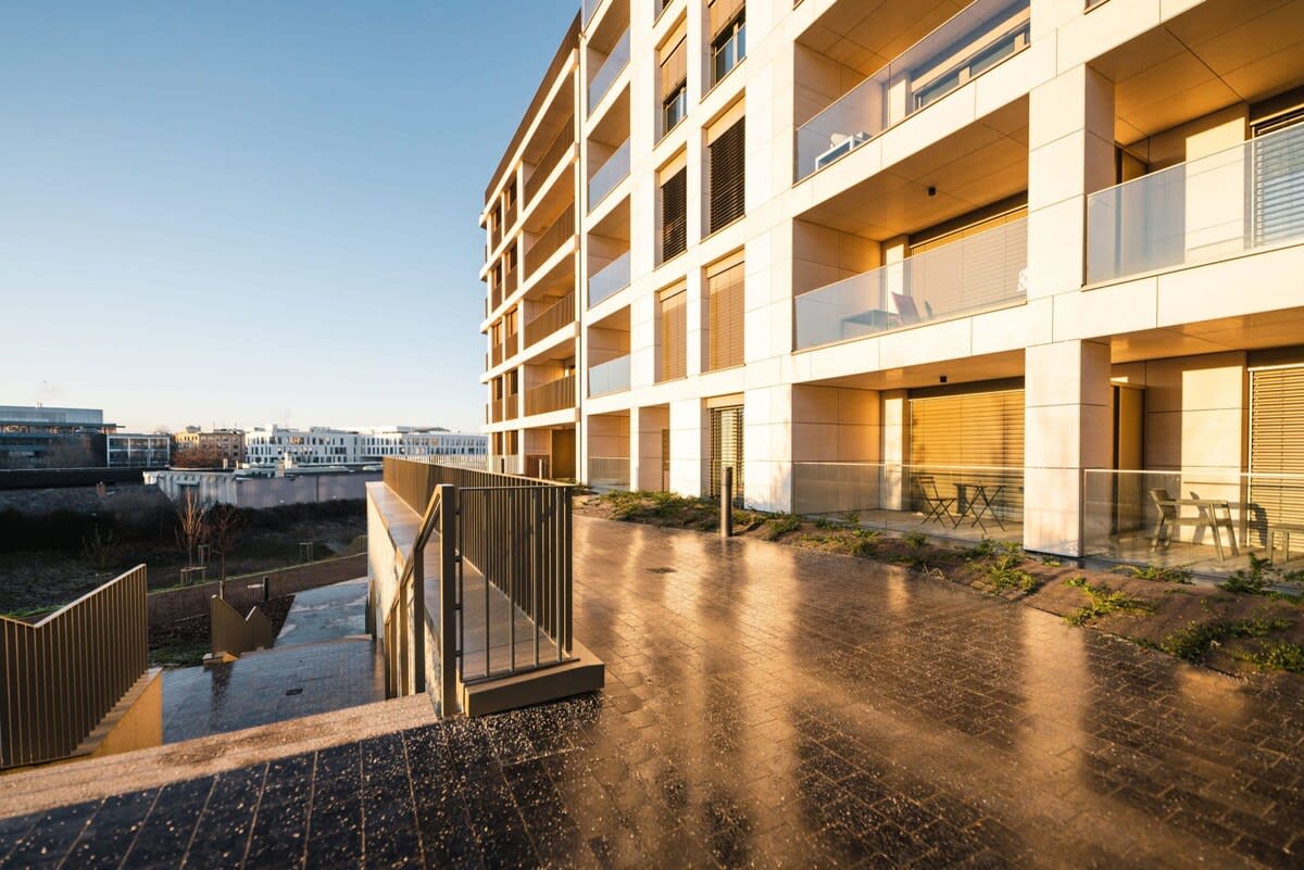 Enjoy the golden hours with a cozy balcony setting, perfect for relaxation or casual dining.