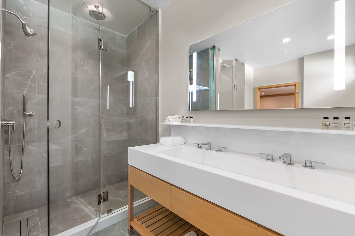 Equipped with LED mirrored lighting, dual sinks, and all of your everyday essential needs