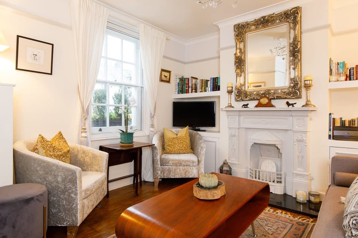 The lounge has original flooring, feature fireplace and sash windows.