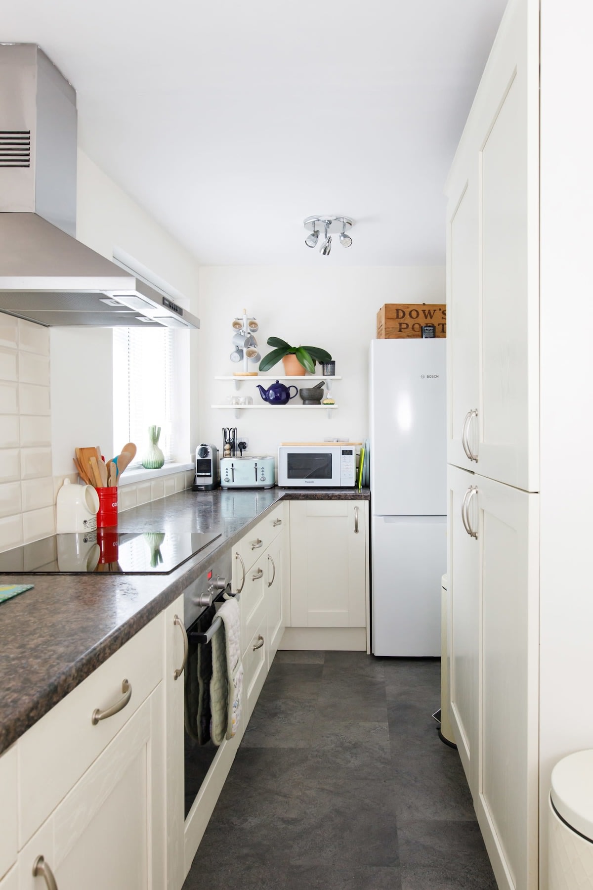 The galley kitchen has spacious worktops and plenty of cabinet space.
