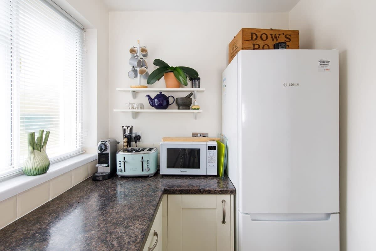 You'll find a Nespresso machine, toaster, kettle, microwave and large fridge freezer.