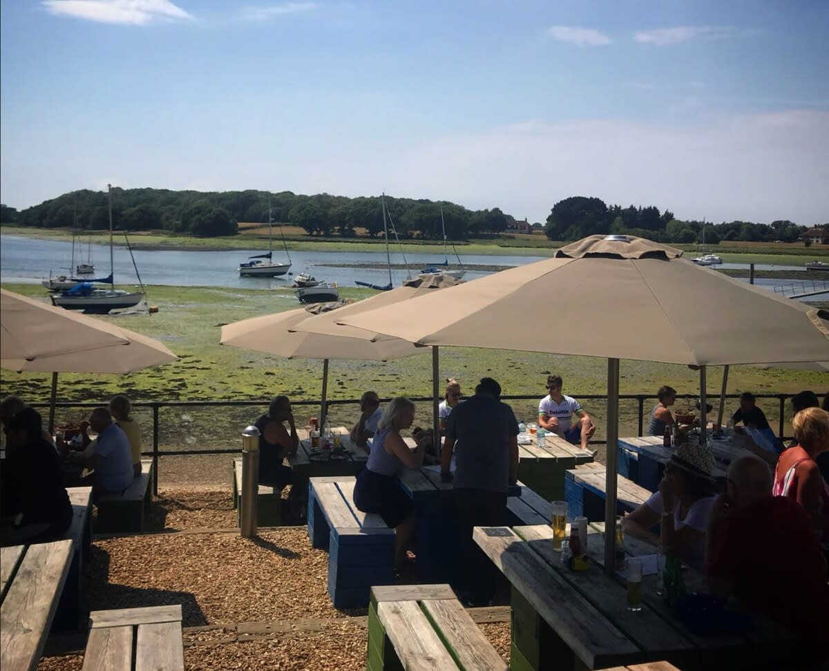 Explore the culinary delights of the local coastline (pictured, The Crown and Anchor, Dell Quay).