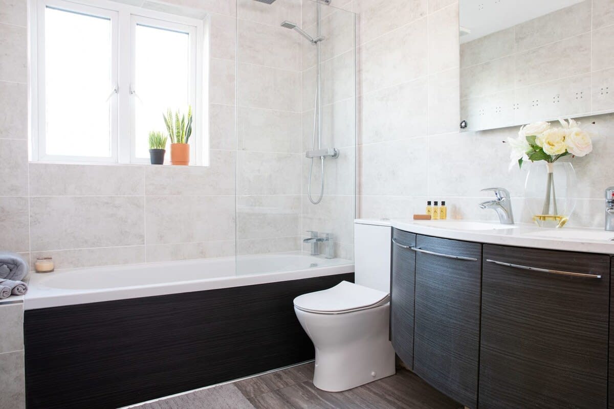 The family bathroom has a tub you can lie back and relax in.