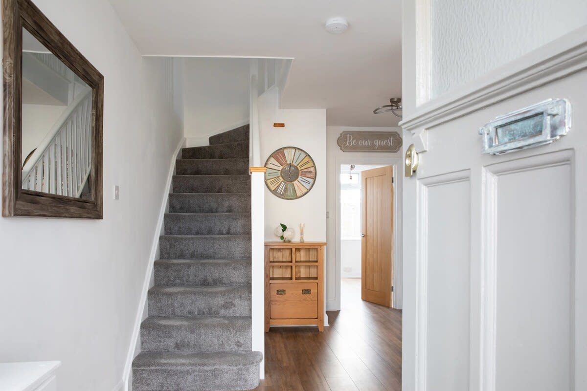 The entrance hall of this detached house for 10 in Bognor Regis.
