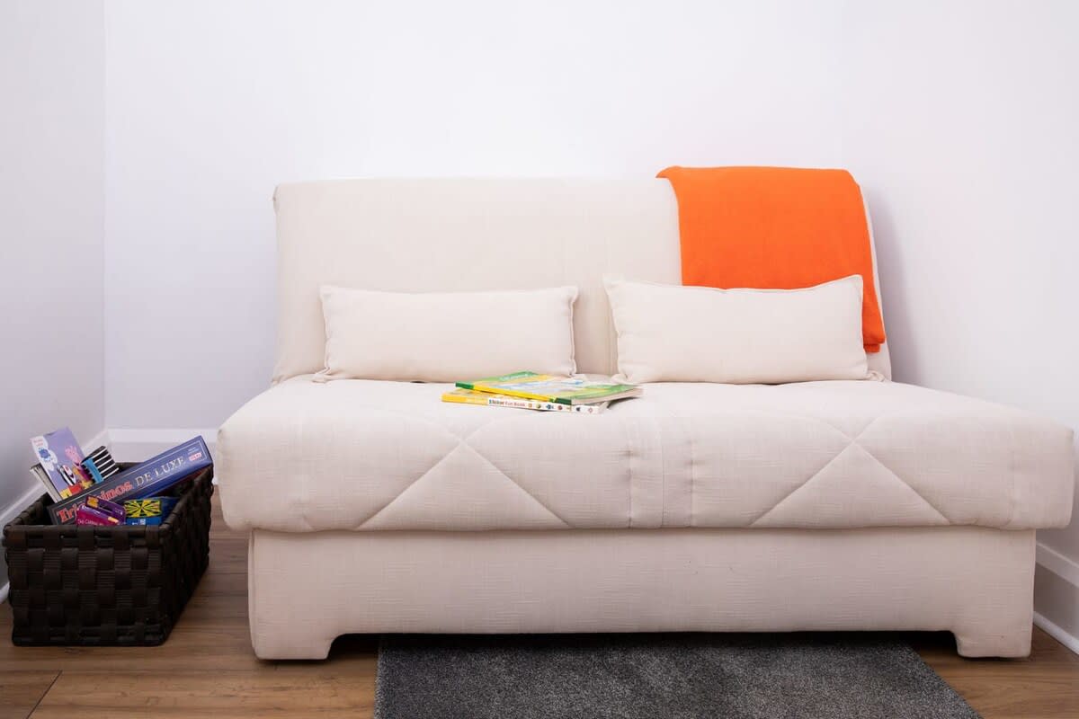 The snug's sofa converts into a comfy bed