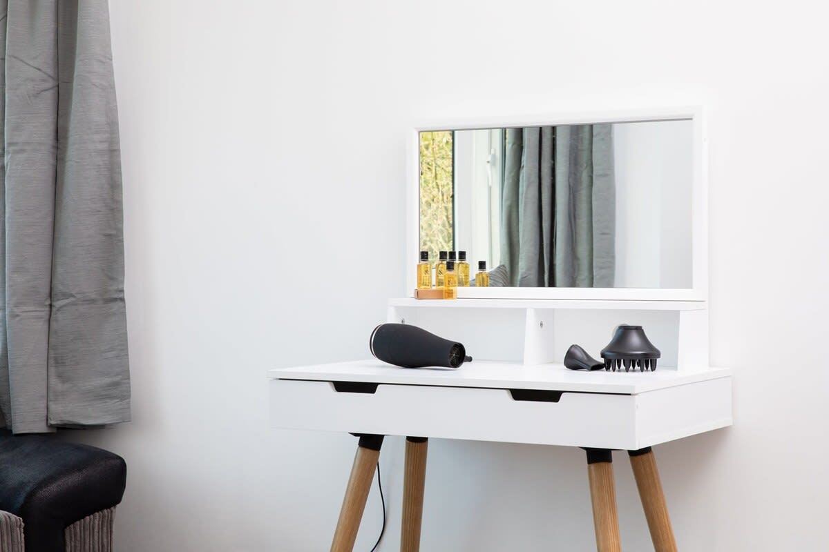 A contemporary dressing table to help guests get ready to go out.