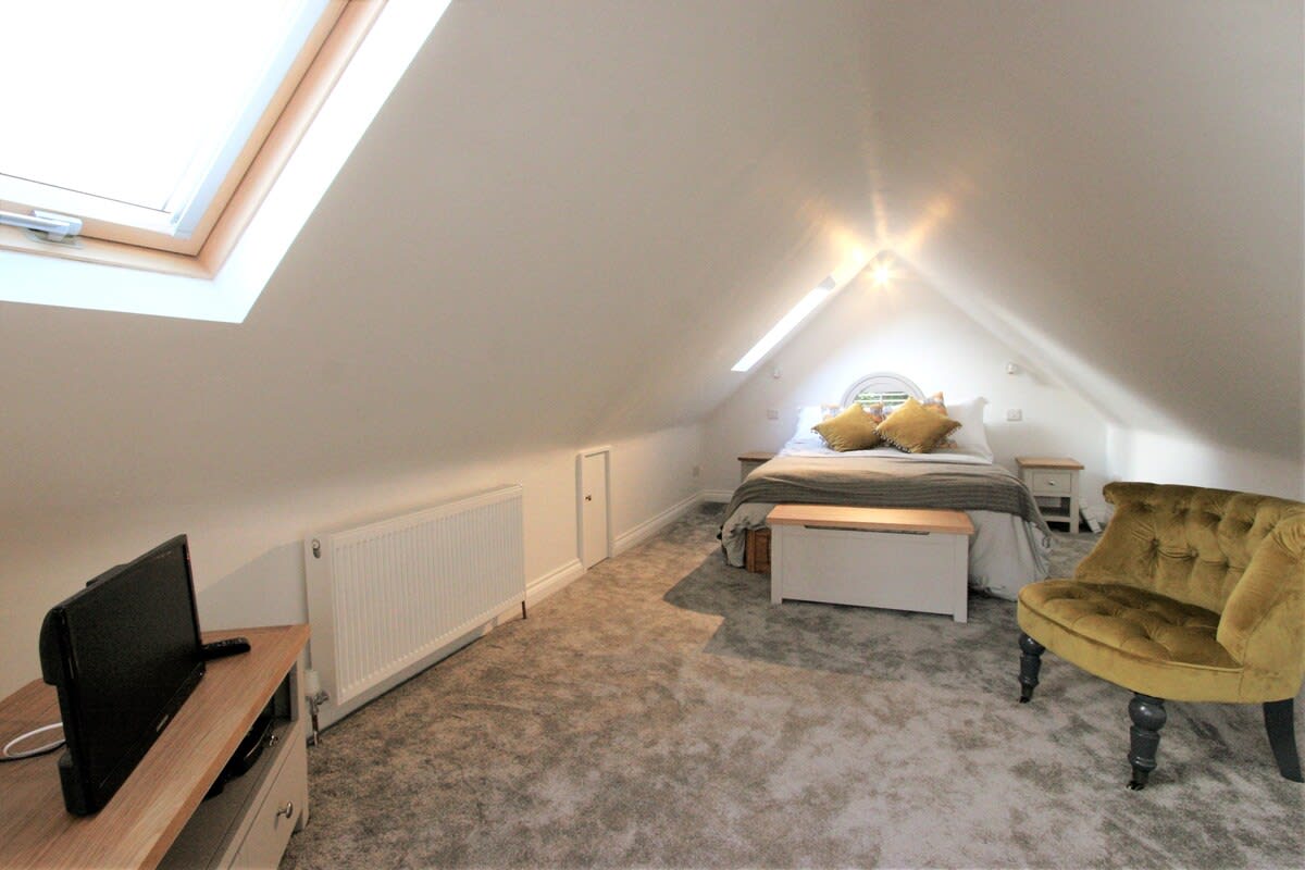 The Bedroom takes up the entire first floor and has a delightful lounge chair to relax before bed