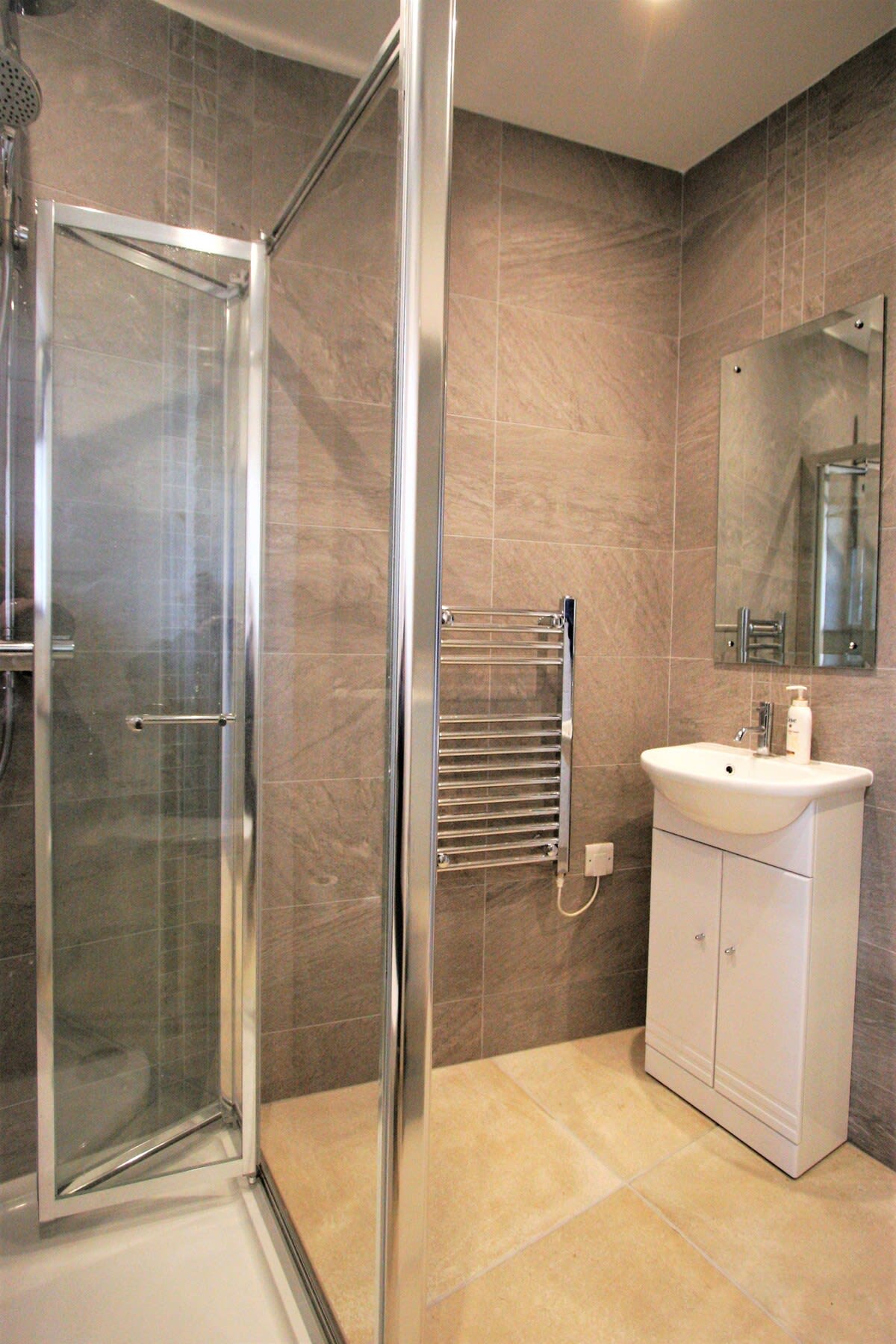 Recently refurbished walk in shower with basin, toilet and heated towel rail