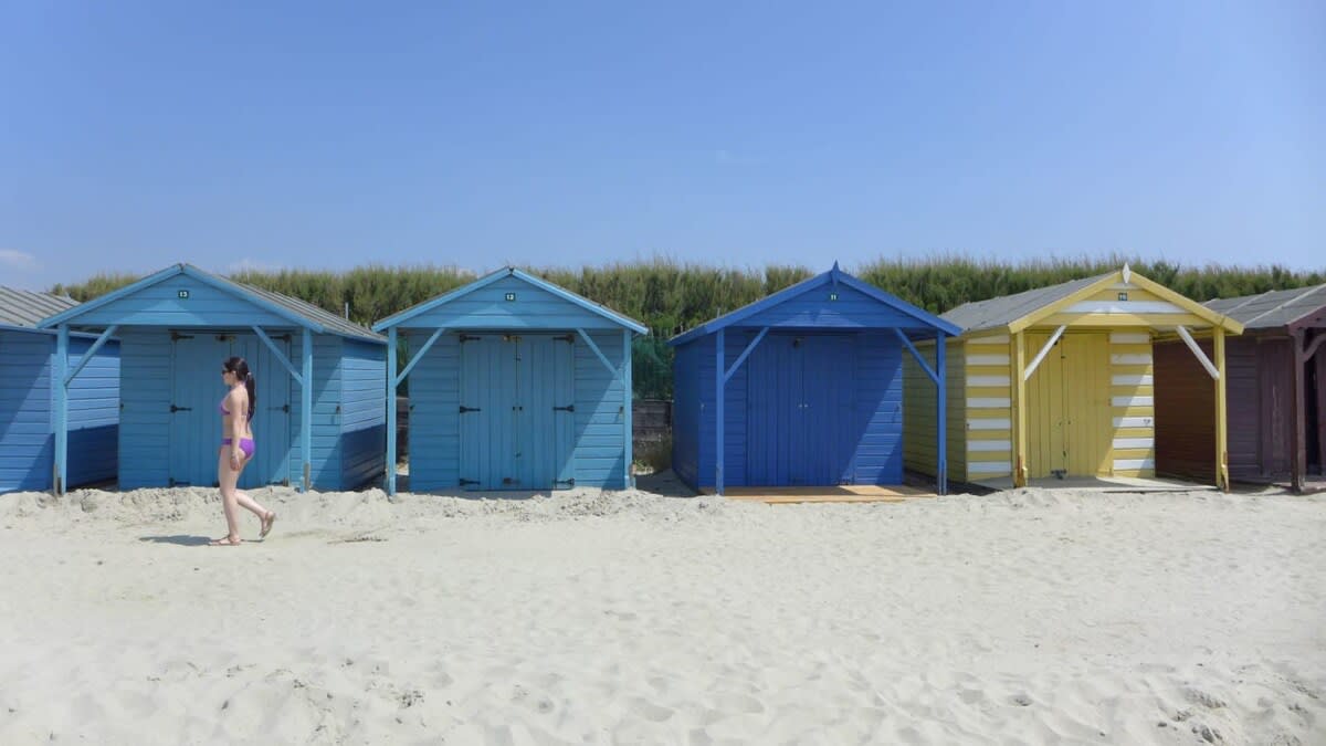 Colourful beach huts at West Wittering's blue flag beach.