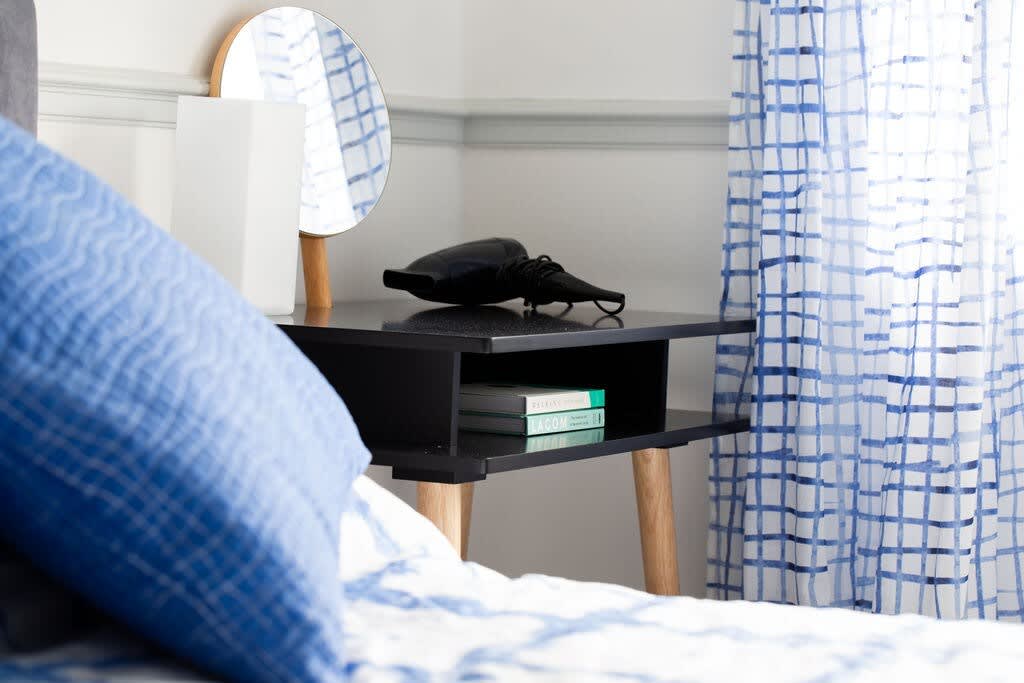 The bedside table offers up some handy storage space.