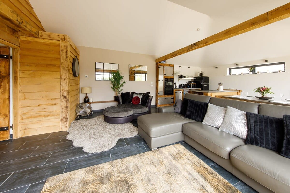 The spacious lounge area has a huge comfy sofa for all the family and Smart TV to watch your favourite shows.