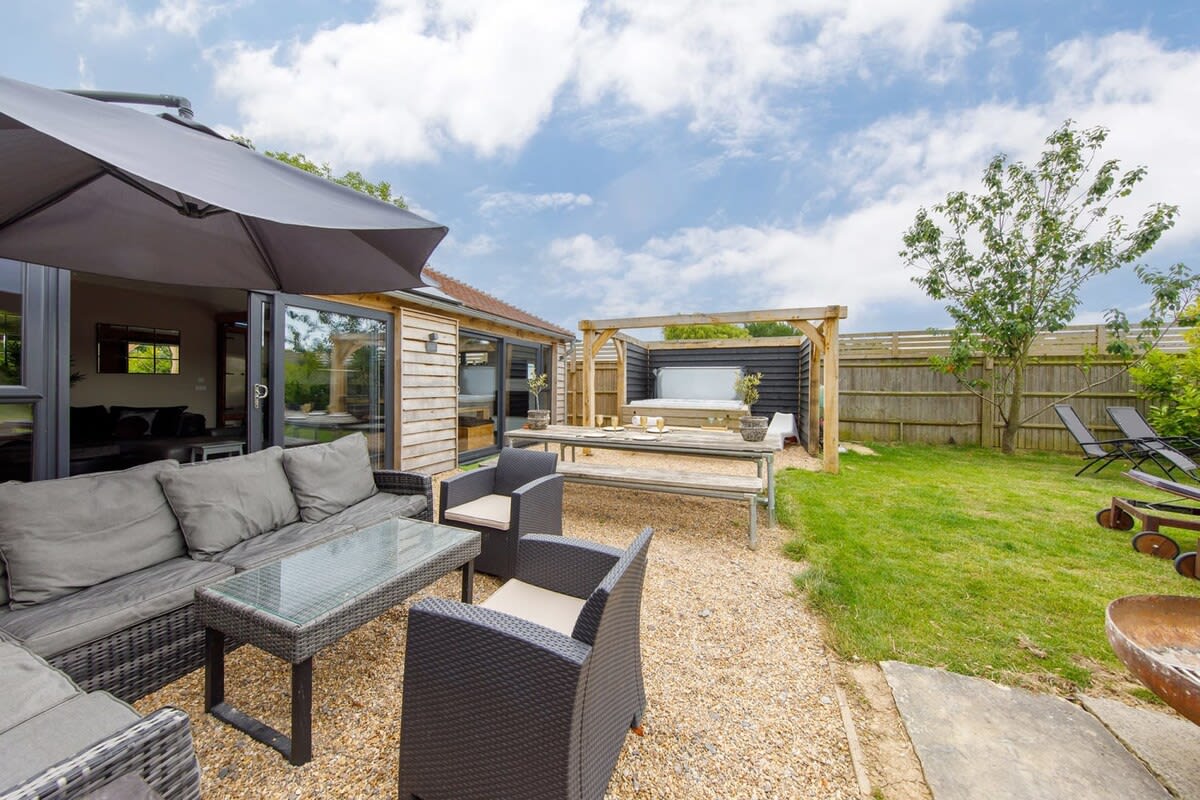 Fire up the BBQ in the evening before relaxing in the hot tub under the stars.