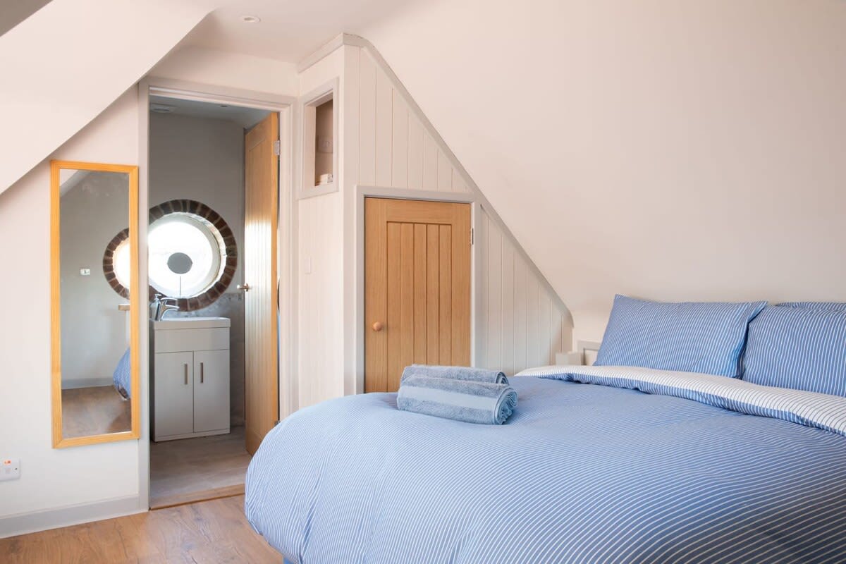 The comfy bedroom has quality linen and bedding for a guaranteed great night's sleep!