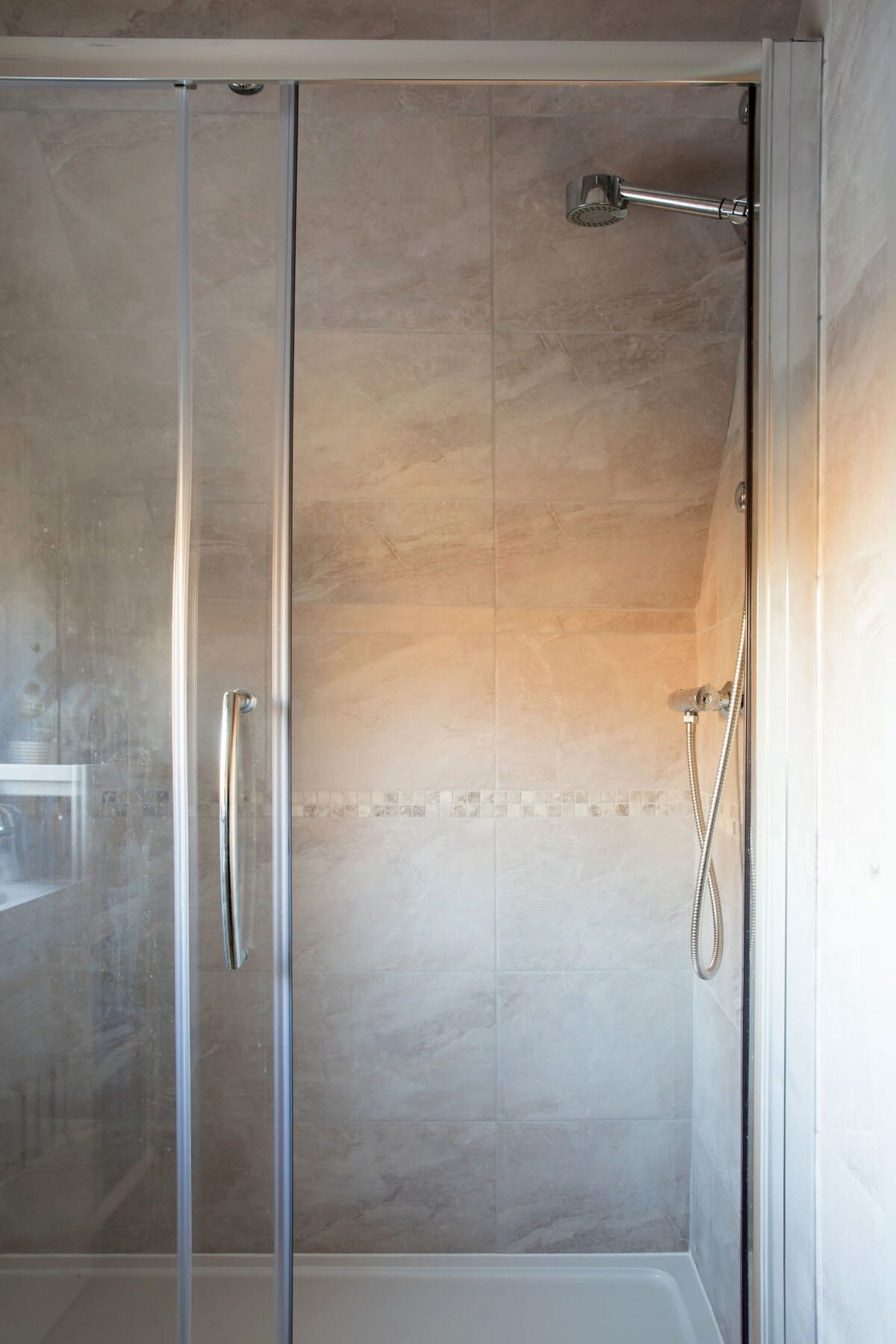The spacious shower is perfect for freshening up after a day at the beach.