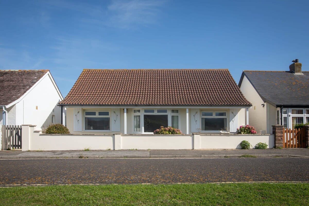 A view of the front of this outstanding detached house a minute from the sea.