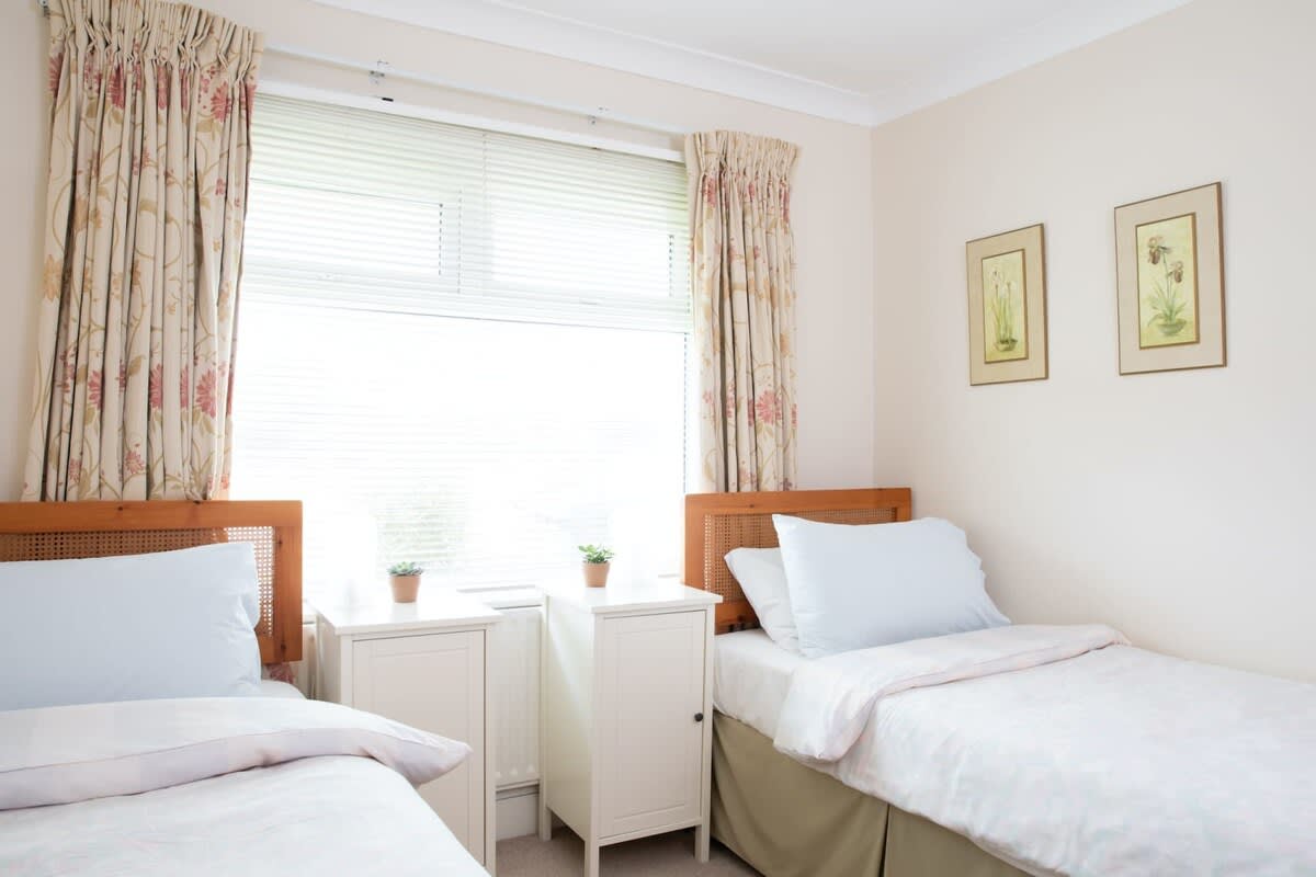 Downstairs twin bedroom with bathroom opposite