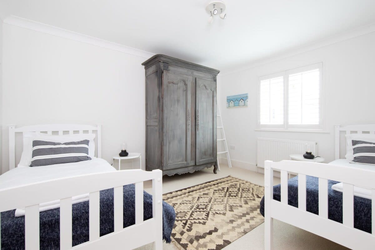 The free-standing wardrobe in the twin bedroom