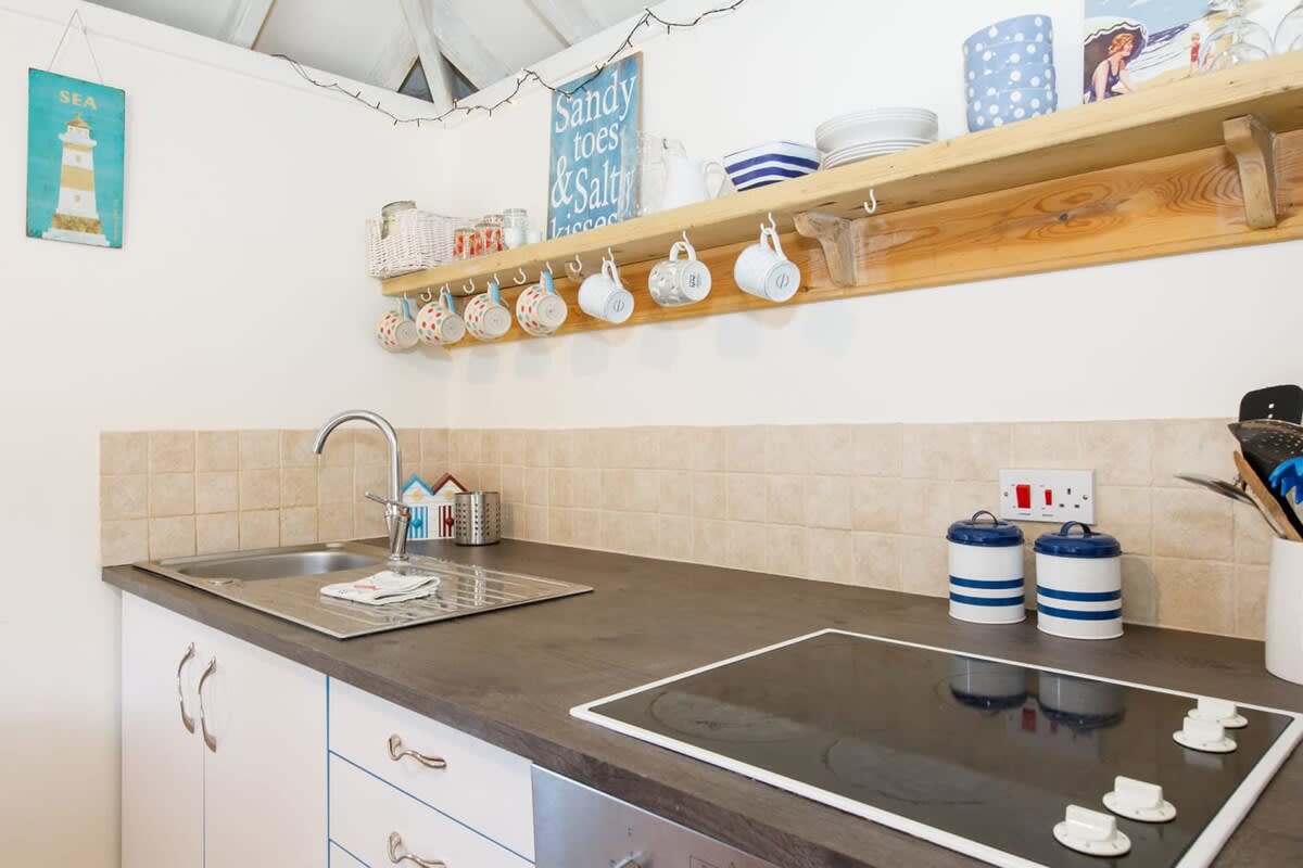 The kitchen has everything you need to make drinks and meals.