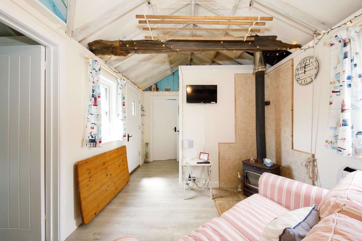 The fold out away dining table is a great space saving idea.