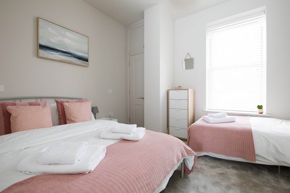 A view of both of the beds in the 2nd bedroom