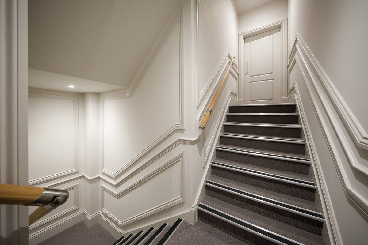 The apartment is accessed via a staircase