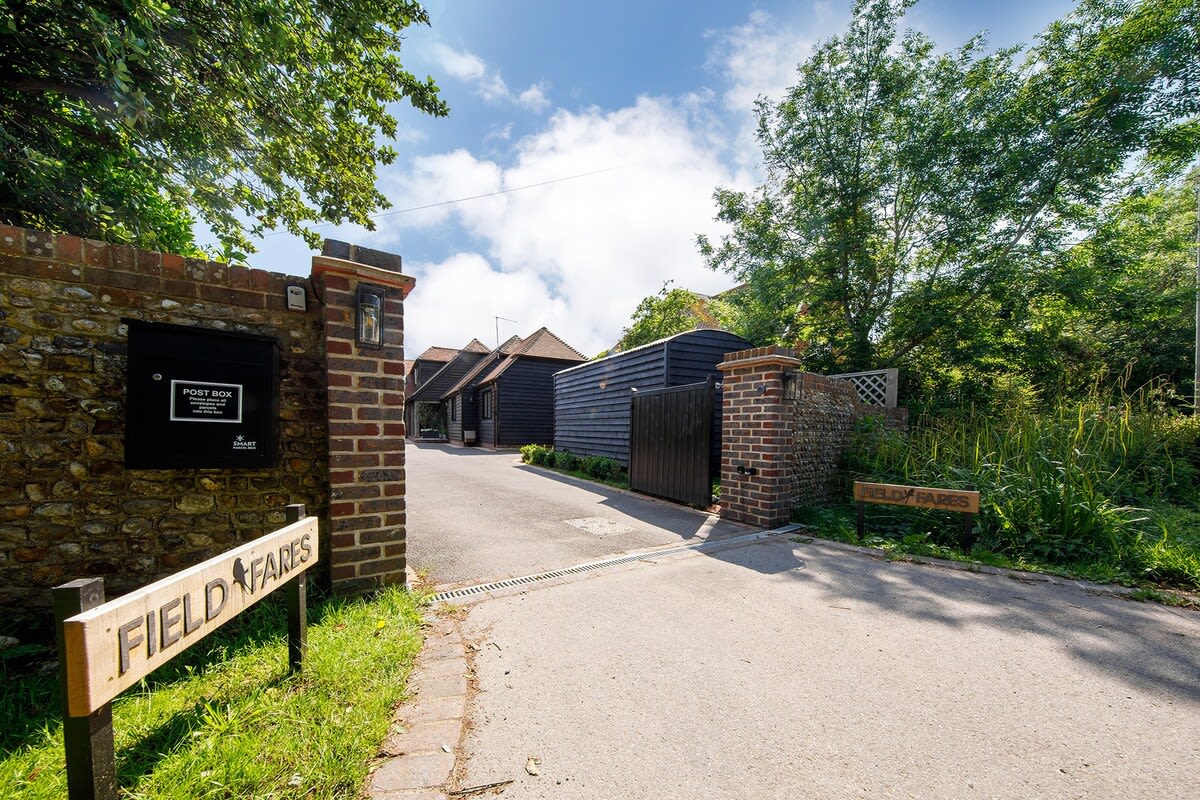 You enter through the main gates and can park outside the annex.