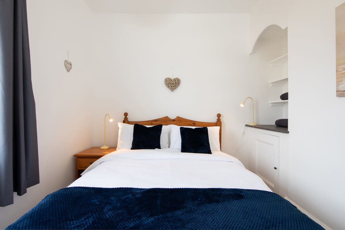 Bedroom one with a comfortable double bed