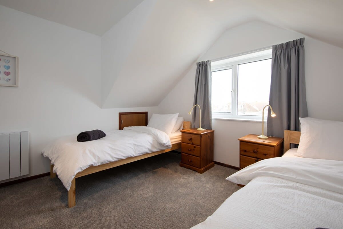 The spacious double loft bedroom with two twin beds