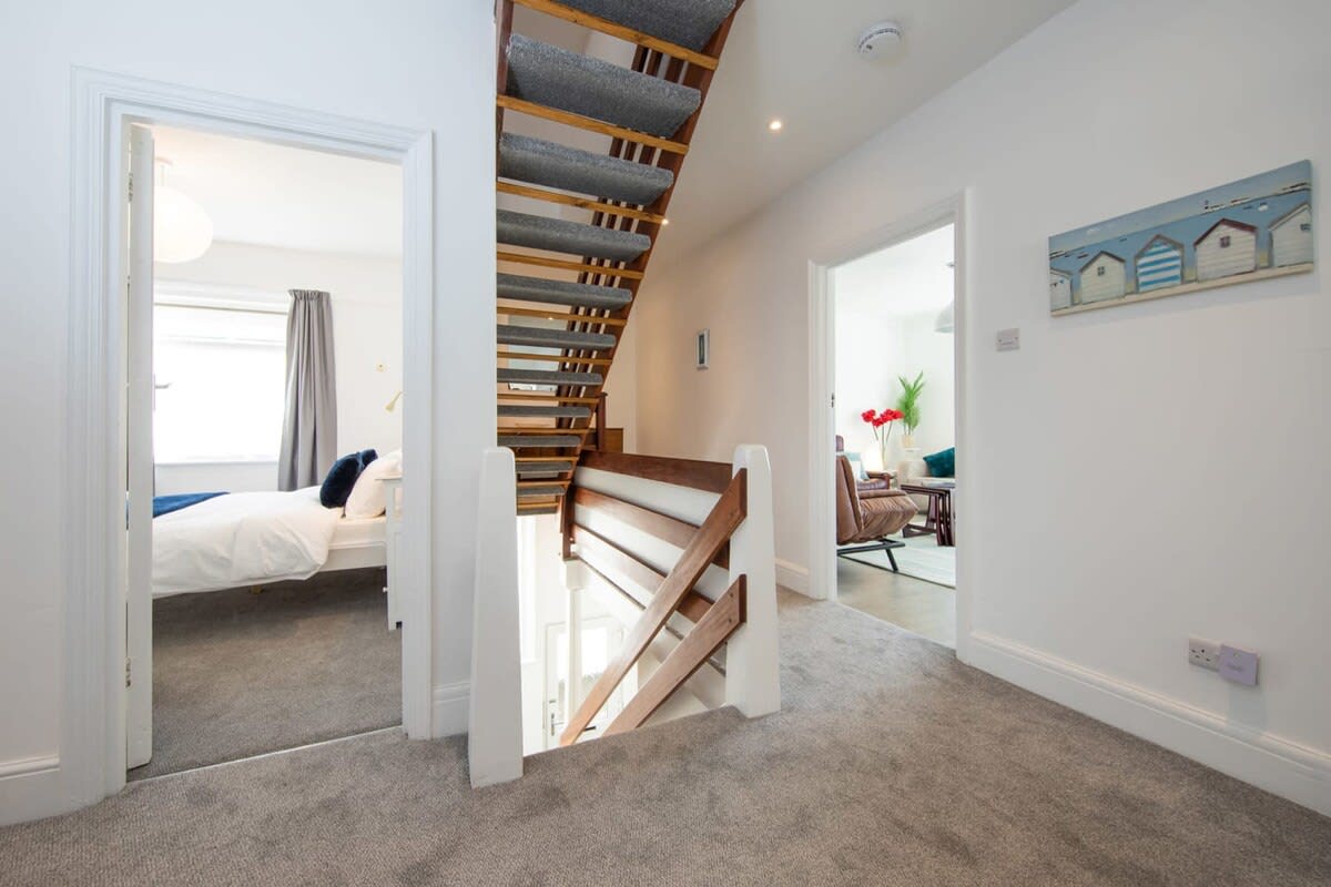Take the soft, carpeted stairs up to the loft space or down to the entrance